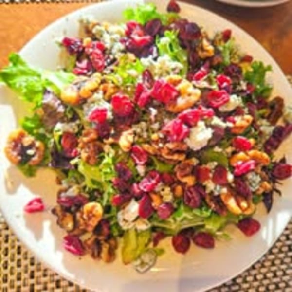 La Porta's vibrant salad with mixed greens, cranberries, walnuts, and blue cheese crumbles.